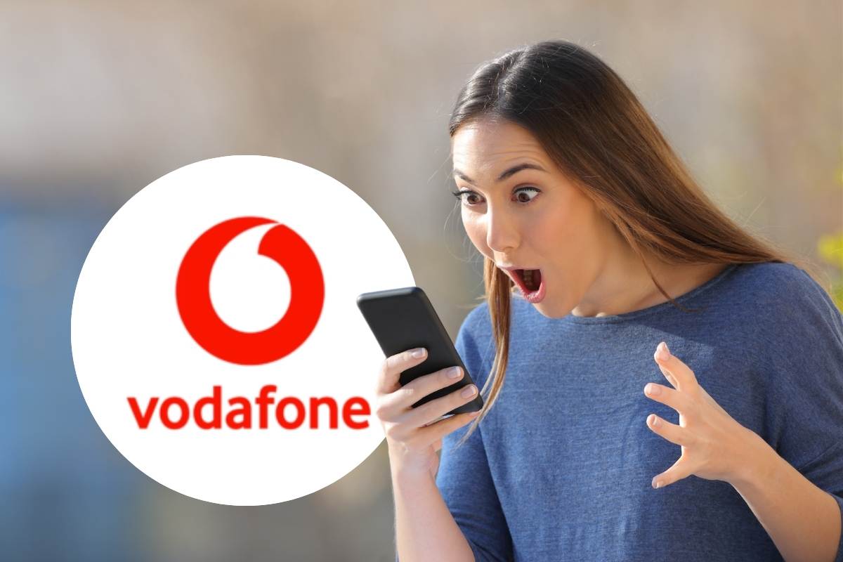 ragazza col telefono e logo vodafone