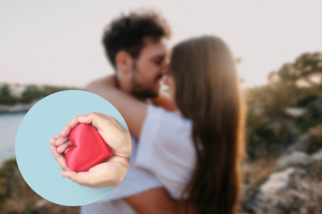 coppia abbracciata all'aperto e cuore tra le mani