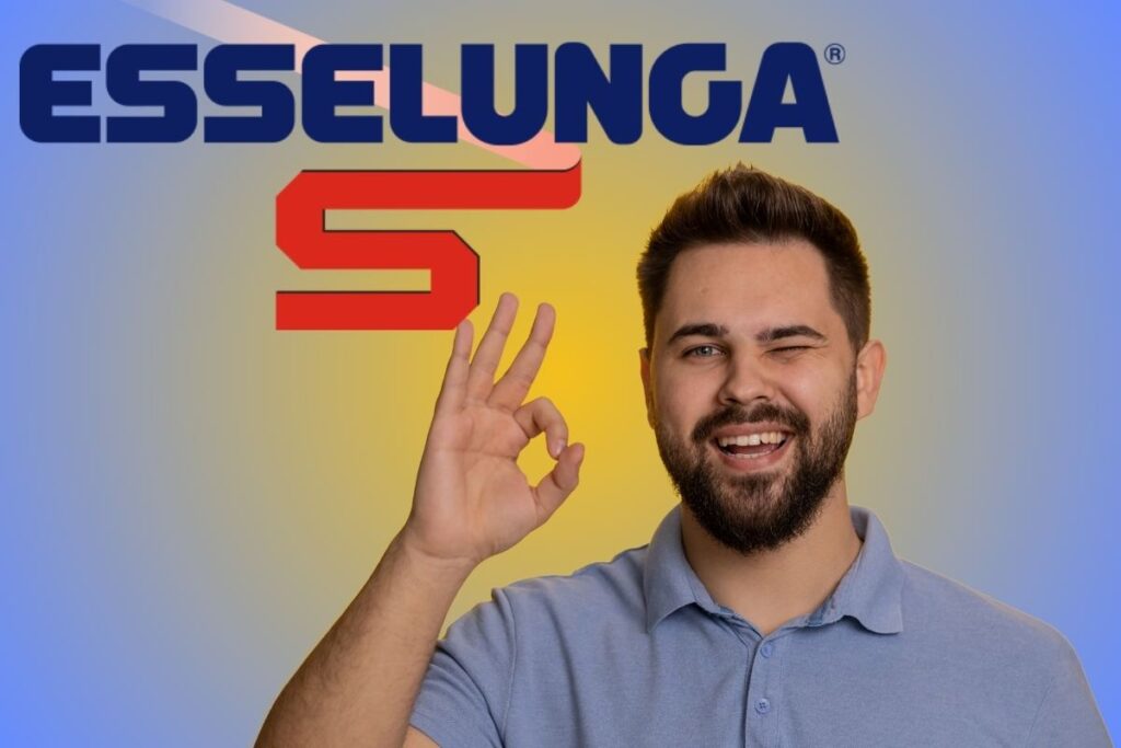 ragazzo fa segno ok con logo esselunga