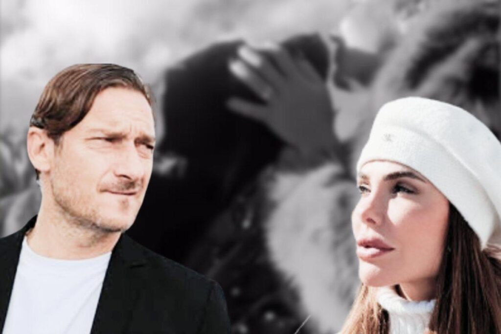 totti e ilary con dietro un cane