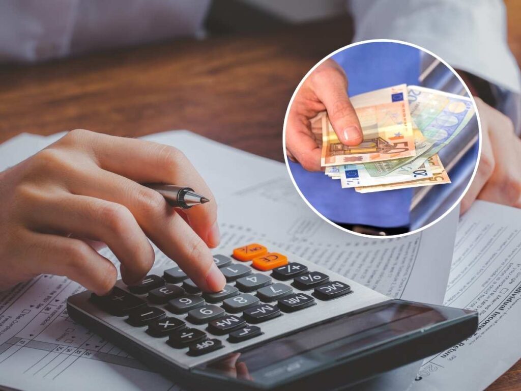 Uomo calcolatrice euro banconote