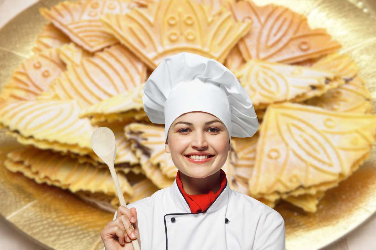 Chef in primo piano e neole sullo sfondo