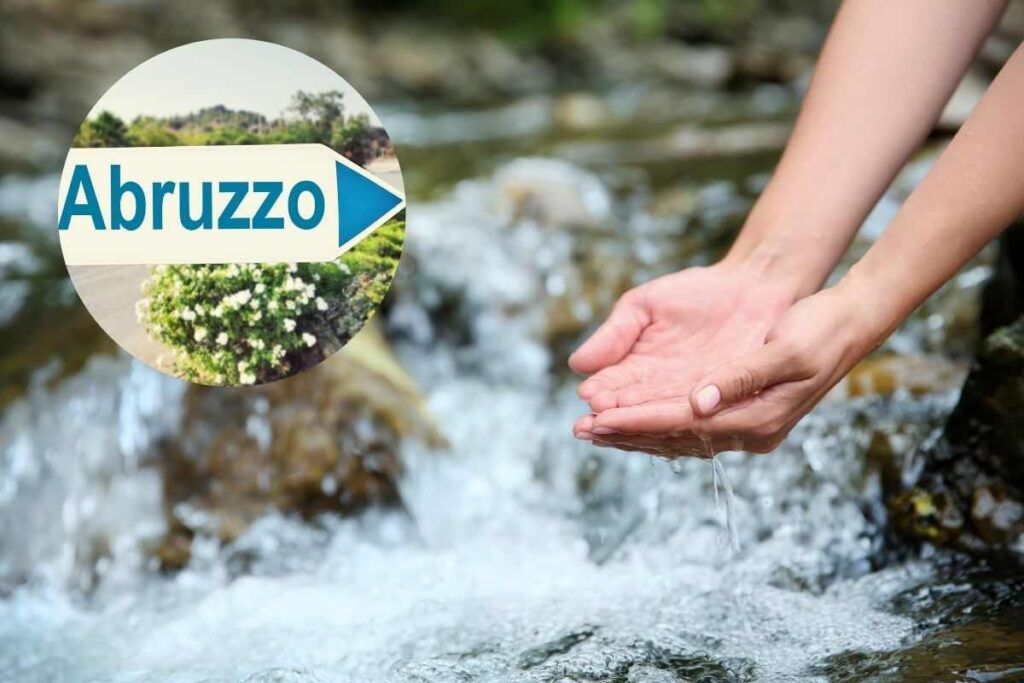 un ruscello e la scritta abruzzo in un cerchio