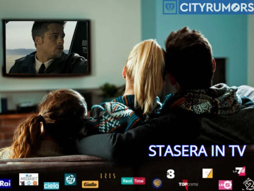 genitori con figlia che guardano un film