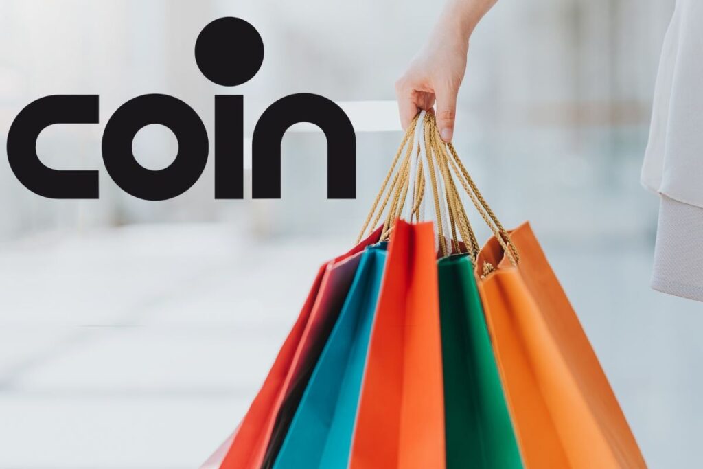 Buste in mano e logo coin