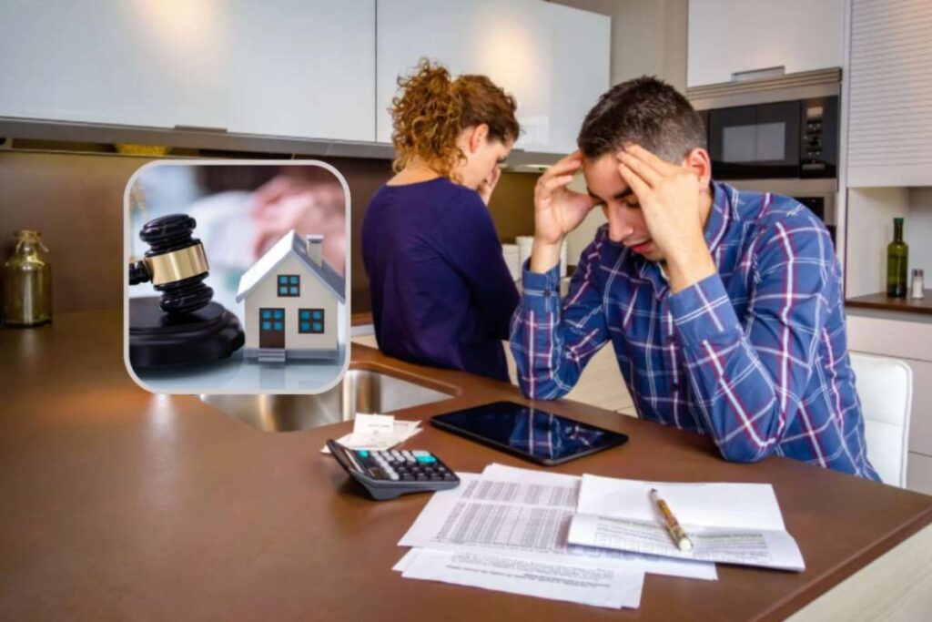 uomo e donna disperati con dei fogli e una calcolatrice