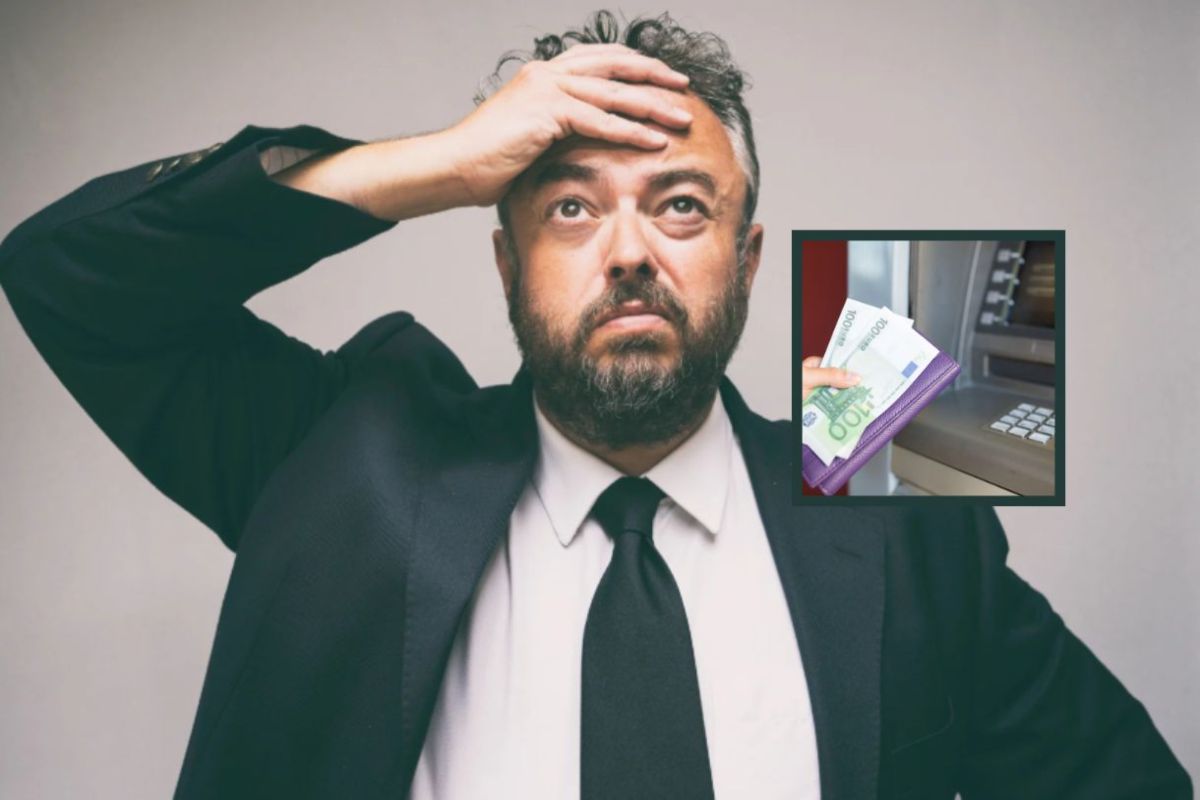 uomo preoccupato con una mano sulla fronte