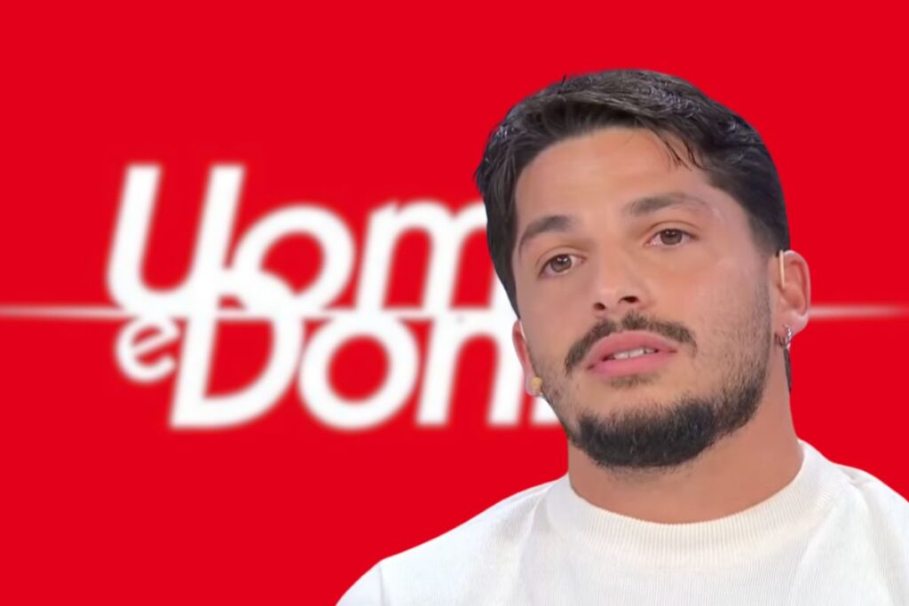 logo di uomini e donne e gianmarco in primo piano