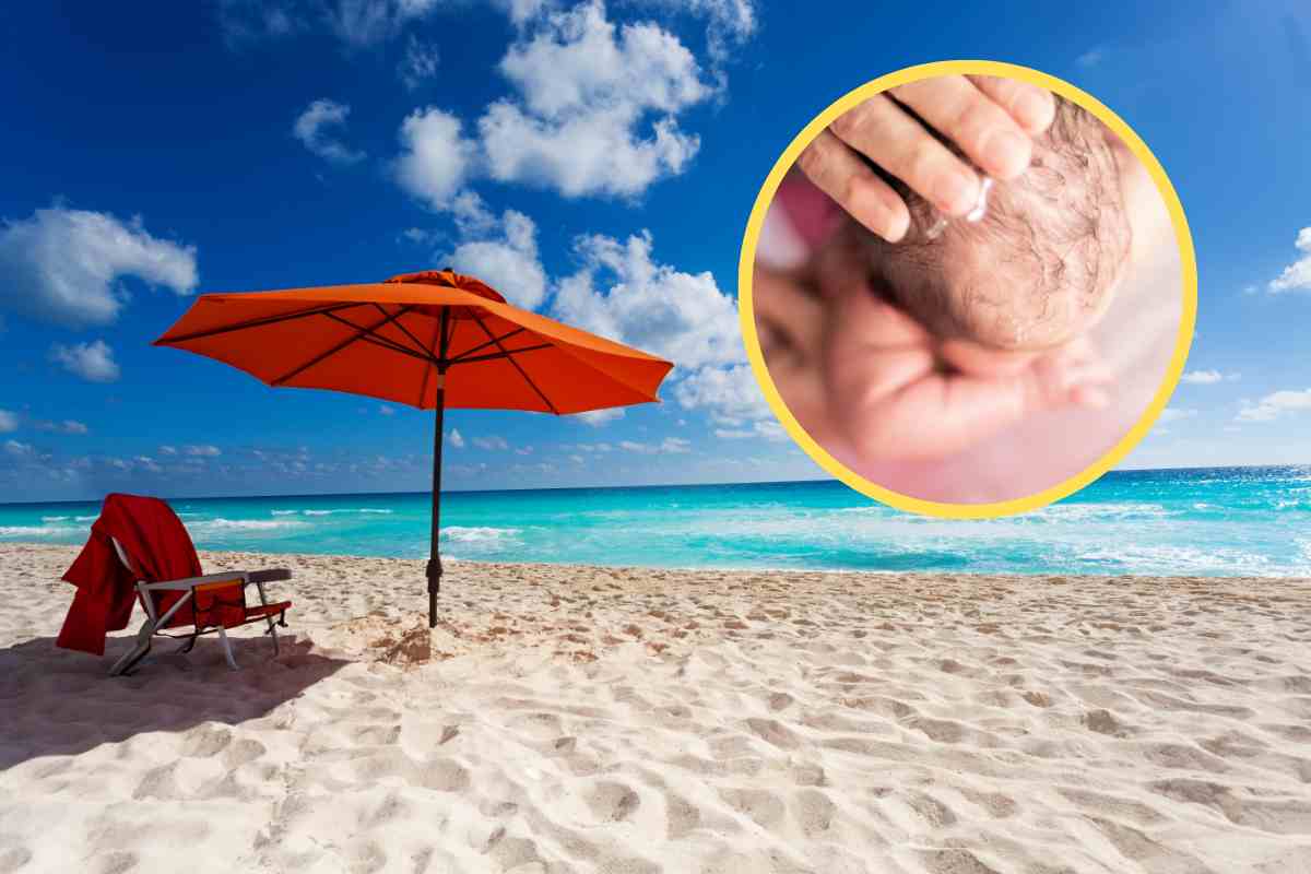Ombrellone in spiaggia e testolina neonato