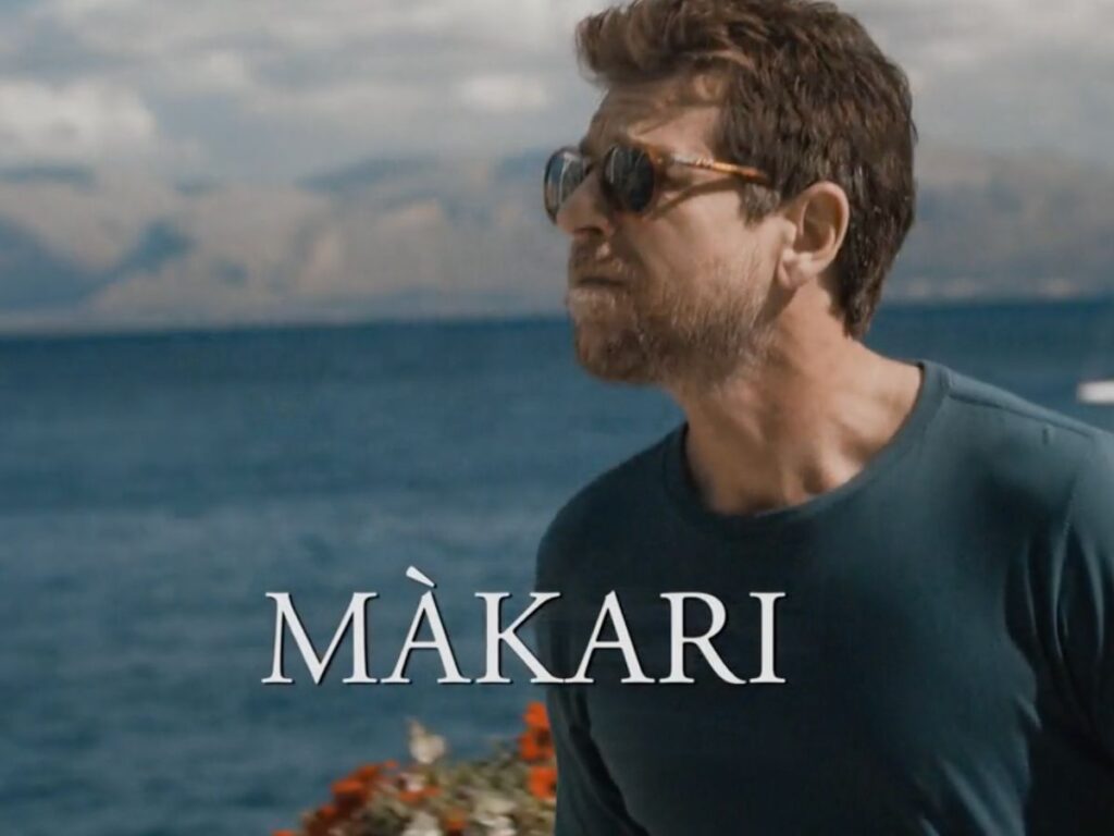 logo makari con claudio gioè sullo sfondo