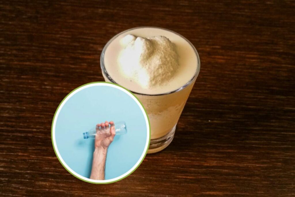 crema caffè in tazza e mano con bottiglia vuota