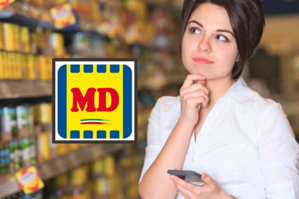 donna al supermercato che riflette con il cellulare in mano e logo md
