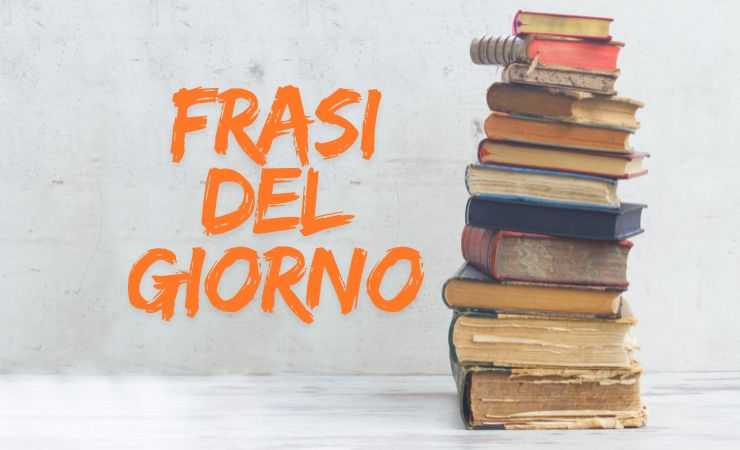 libri impilati e scritta frasi del giorno