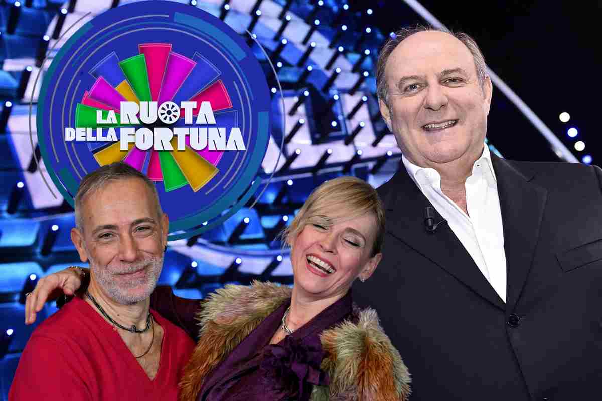 Gerry Scotti coi Jalisse ed il logo de La Ruota della Fortuna